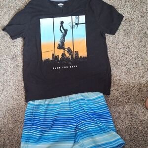 Black graphic Old Navy boys T-shirt, Paired With Blue/white Swim Trunks